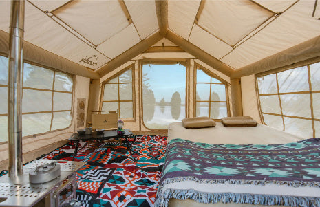 Inflatable tent house for family camping with multiple rooms.